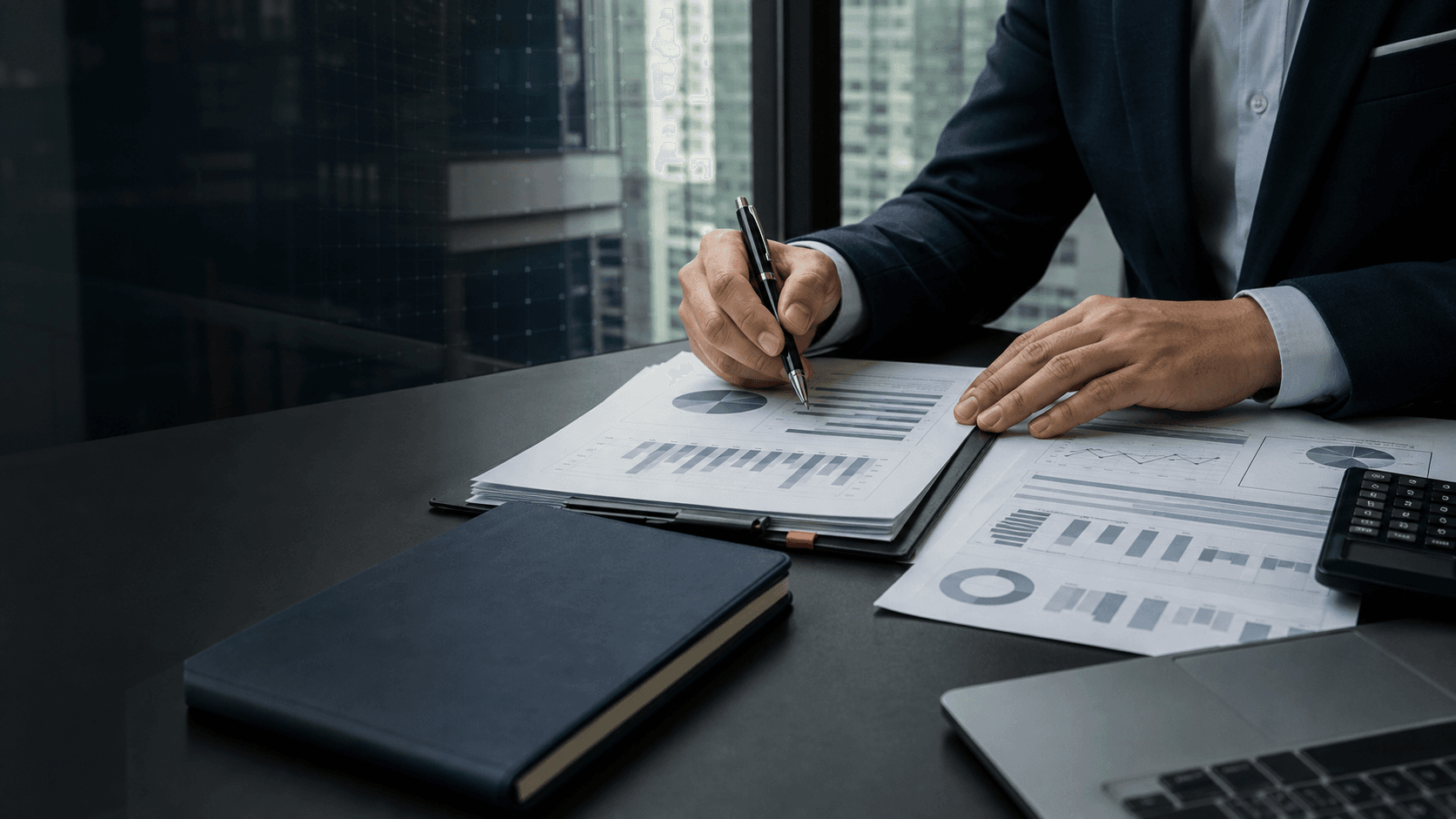 Portfolio documents being reviewed at a finance desk